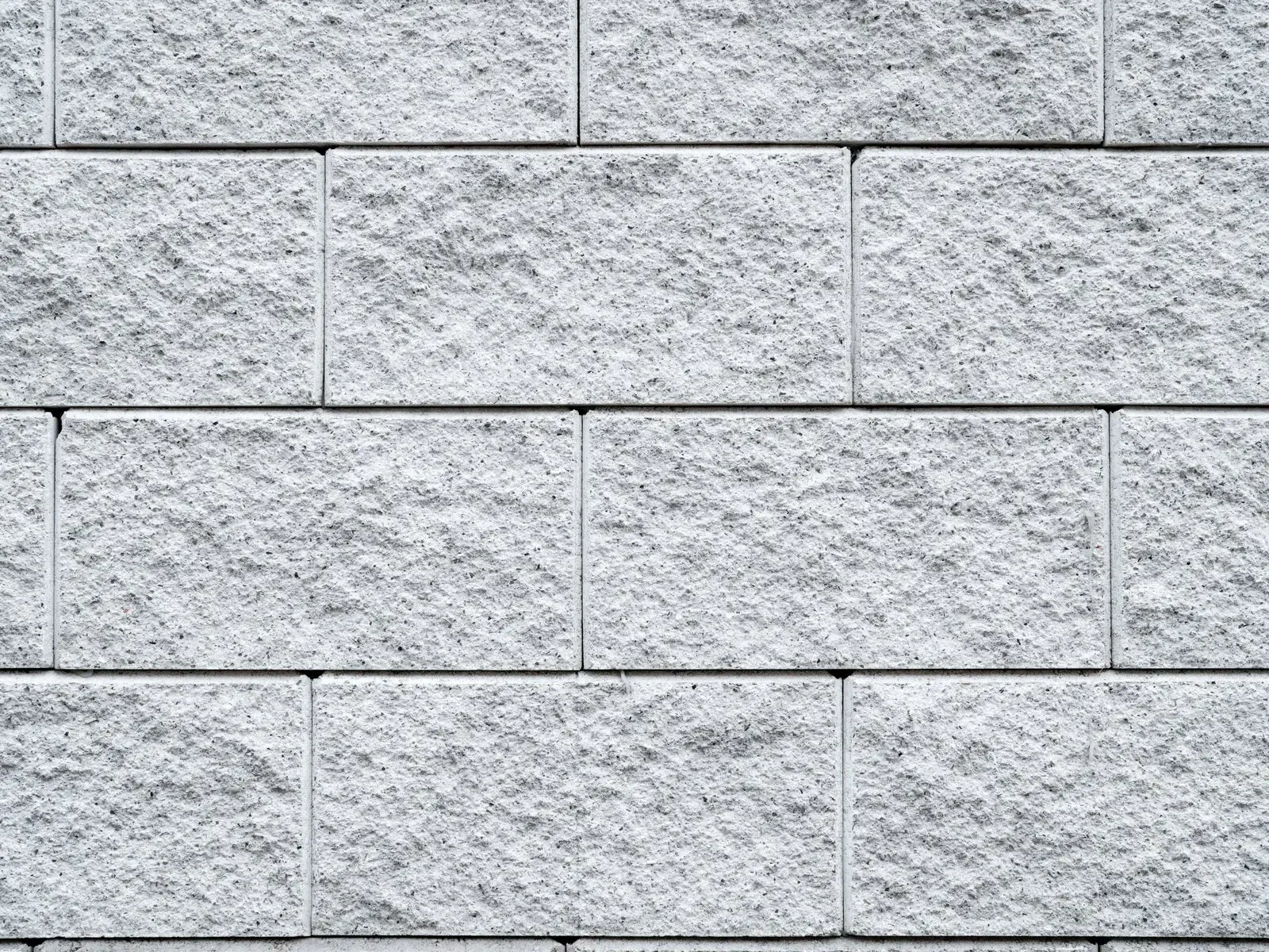 Close-up of a split-face concrete block (CMU) wall surface